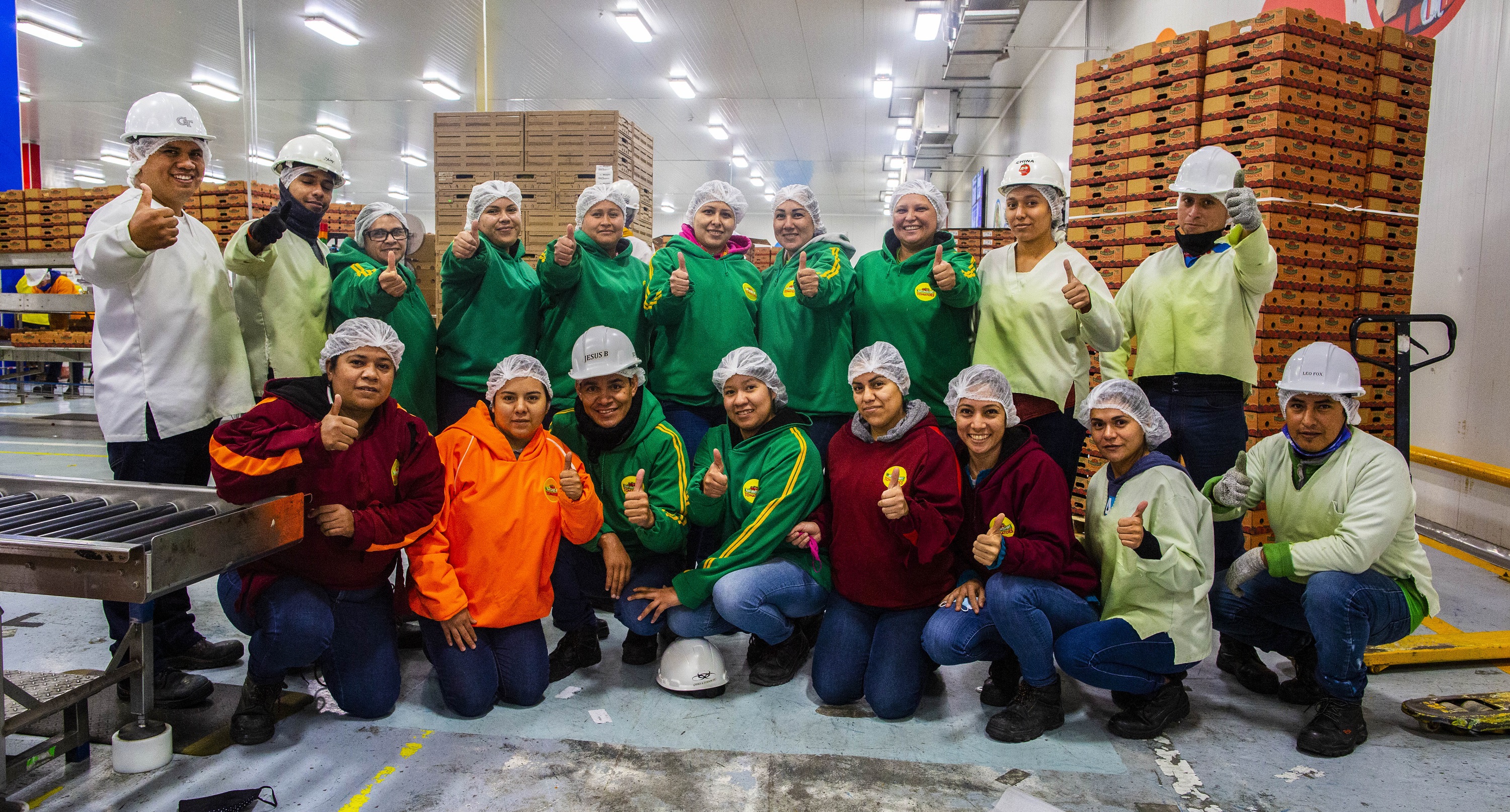 Employees of Nature Sweet pose for group picture.